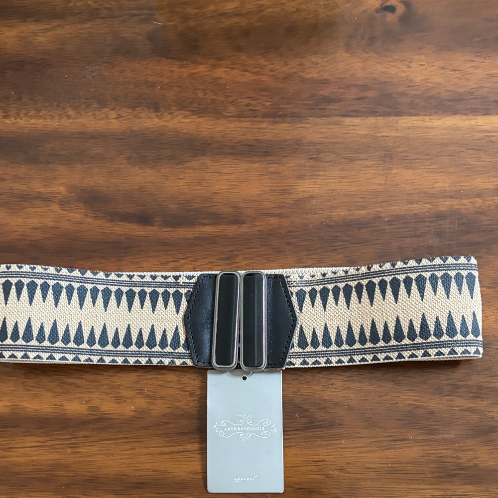 NWT Anthropologie elastic belt. Black and tan design with black accent closure.